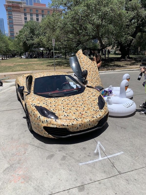 Doge-plastered sports car